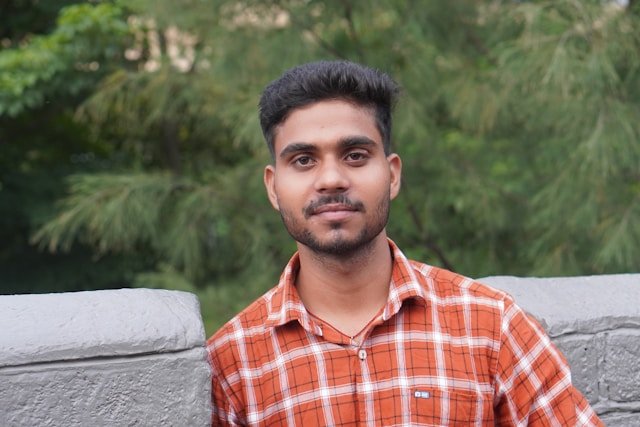 Satisfied male applicant celebrating successful SSC form submission through OnlineCyberCafe.in